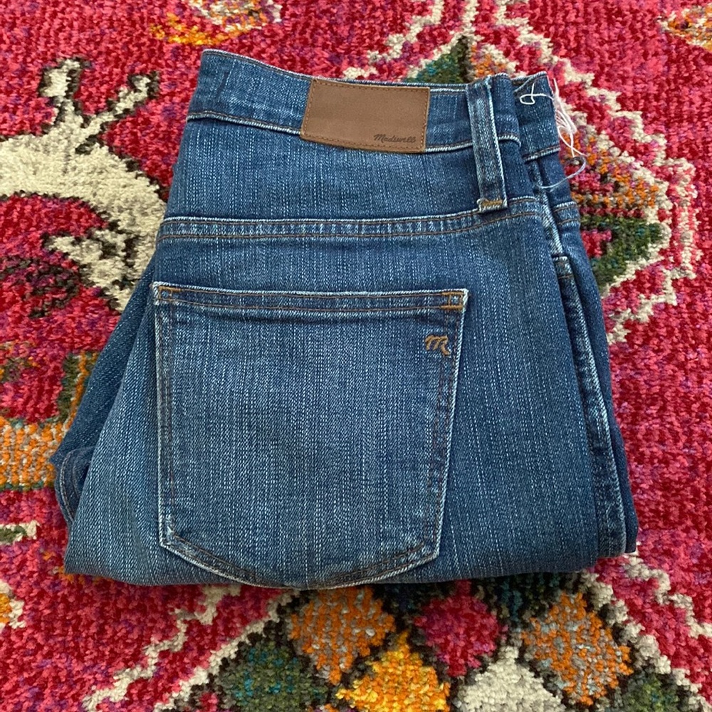 Madewell high waisted denim with frayed ankle and distressed knee. Size 26.
